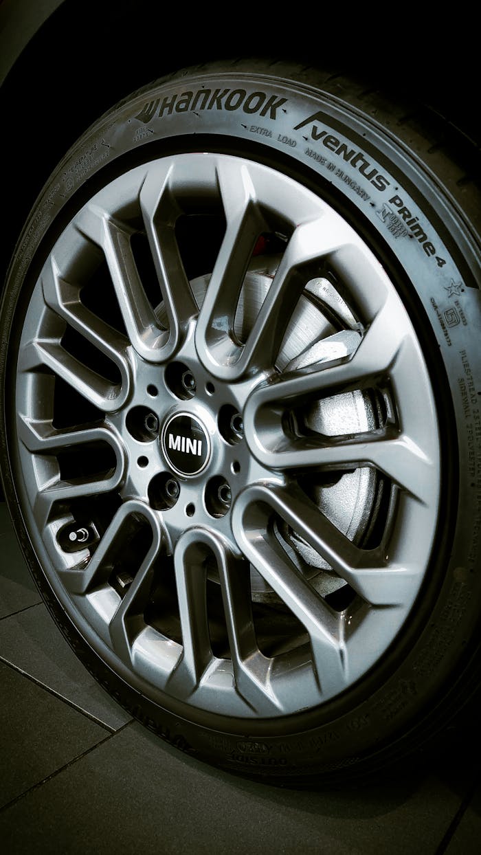 High detail image of a MINI car wheel rim with Hankook tire, showcasing modern design.
